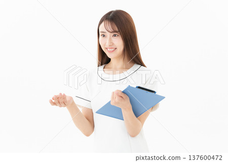 Young female esthetician on white background Young female esthetician on white background 137600472