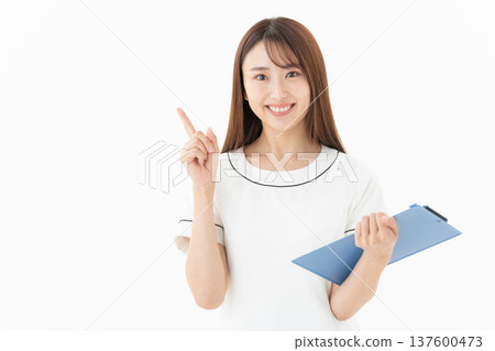 Young female esthetician on white background Young female esthetician on white background 137600473