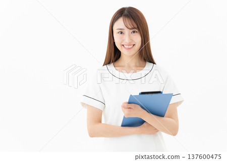 Young female esthetician on white background Young female esthetician on white background 137600475