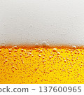 Closeup of beer with rising bubbles and foam on a white background showing freshness concept 137600965