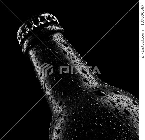 Chilled beer bottle covered in droplets shown in studio lights isolated on dark background with clipping path concept of freshness Chilled beer bottle covered in droplets shown in studio lights isolated on dark background with clipping path concept of freshness 137600967