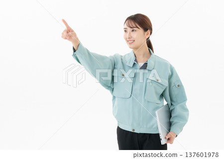 Young female worker on white background 137601978