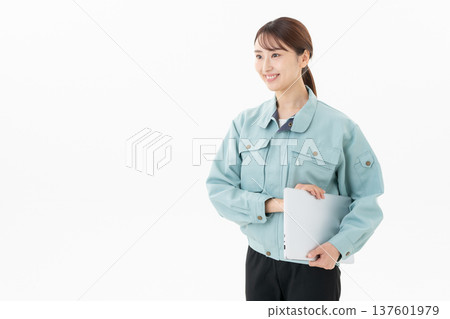 Young female worker on white background 137601979