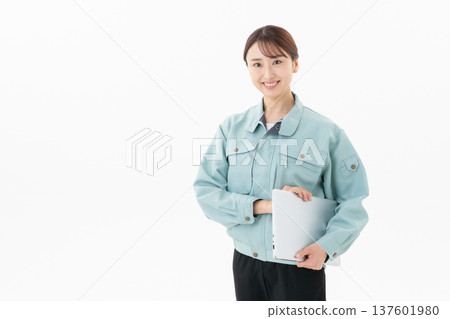 Young female worker on white background 137601980