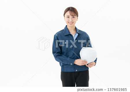 Young female worker on white background 137601985