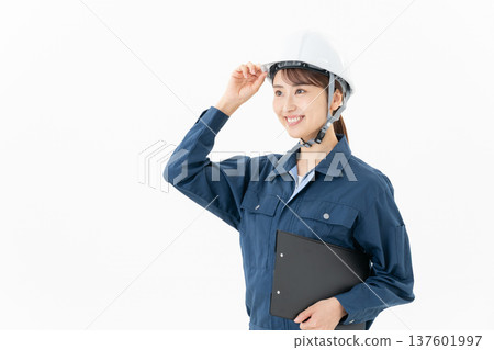 Young female worker on white background 137601997