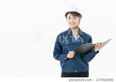 Young female worker on white background 137602000