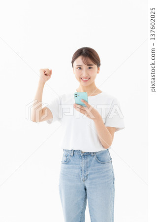 Young woman in a T-shirt on a white background Young woman in a T-shirt on a white background 137602025