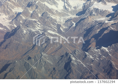 Close-up view of the Himalayan mountain range from the window of a mountain flight airplane Close-up view of the Himalayan mountain range from the window of a mountain flight airplane 137602294