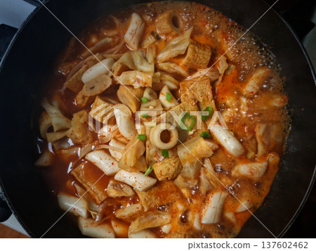 This is Korean style tteokbokki being boiled in a pot. This is Korean style tteokbokki being boiled in a pot. 137602462