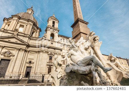 Fountain of the Four Rivers and Sant Agnese in Agone church at Piazza Navona in Rome Italy Fountain of the Four Rivers and Sant Agnese in Agone church at Piazza Navona in Rome Italy 137602481