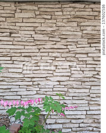 It's a stone wall and a golden bell. It's a stone wall and a golden bell. 137602586