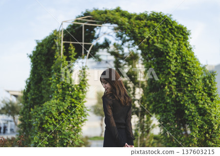 Woman enjoying a walk at sunset Woman enjoying a walk at sunset 137603215