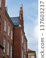Historic red brick building with Gothic architecture 137603237