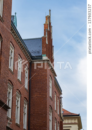 Historic red brick building with Gothic architecture Historic red brick building with Gothic architecture 137603237