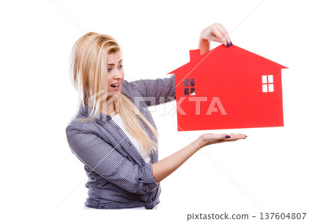 Happy woman holding red paper house 137604807
