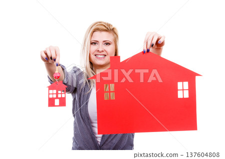 Happy woman holding red paper house and keys 137604808