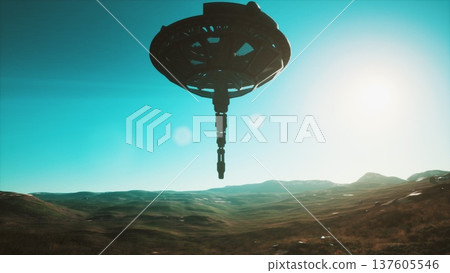 A sleek, high tech device hovers above a vast, green valley, illuminated by sunlight. The landscape features rolling hills and distant mountains, creating a serene environment. A sleek, high tech device hovers above a vast, green valley, illuminated by sunlight. The landscape features rolling hills and distant mountains, creating a serene environment. 137605546
