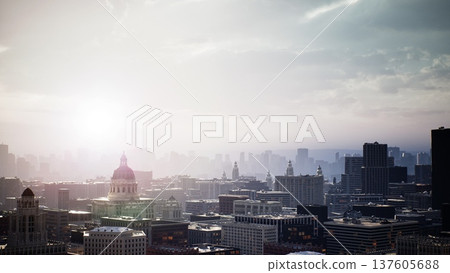 Sunrise skyline over sprawling cityscape bathed golden light, domed landmark and highrise towers recede into mist, soft lens flare creates cinematic glow, 137605688