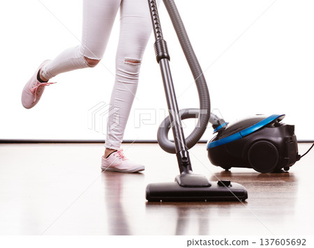 Woman legs and vacuum cleaner Woman legs and vacuum cleaner 137605692
