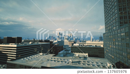 developmentfocused skyline with modern tower and construction hints, cranes in distance, dense blocks, marketready vibe and investment potential. 137605976