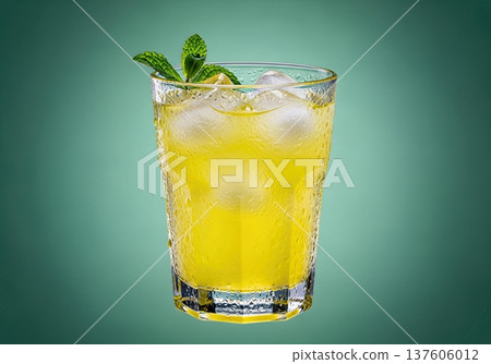Cold glass of fresh yellow lemonade with ice cubes and mint sprig covered in water droplets 137606012
