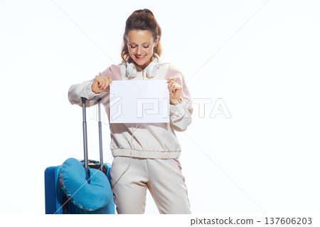 Joyful Traveler with Suitcase Holding Blank Placard 137606203