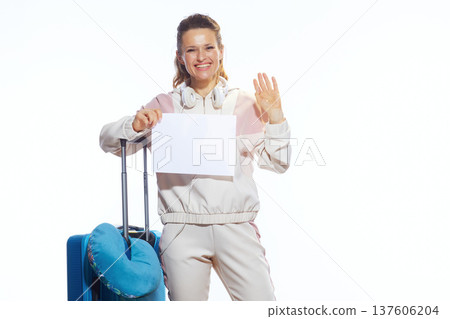 Friendly Female Traveler Holding Empty Sign and Waving Friendly Female Traveler Holding Empty Sign and Waving 137606204