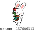 A rabbit holding a potted tulip 137606313