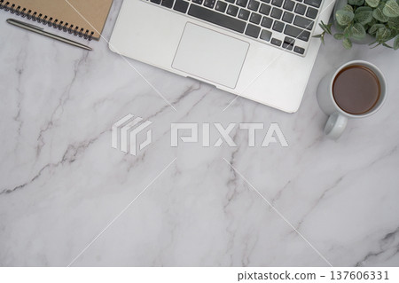 Modern laptop setup on marble desk with coffee for remote work Modern laptop setup on marble desk with coffee for remote work 137606331