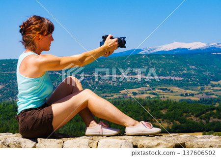 Woman take photo on mountain nature in France Woman take photo on mountain nature in France 137606502