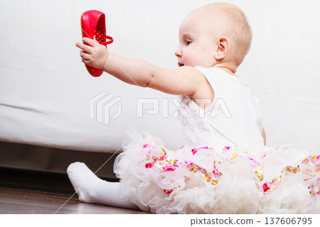 Little girl with red shoes Little girl with red shoes 137606795