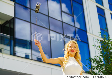Cheerful fashionable woman in city 137606906