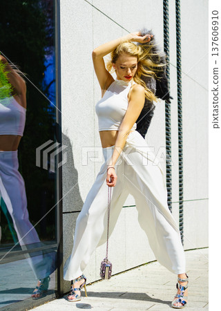 Woman wearing crop top and culottes 137606910