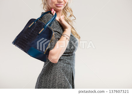 Chic woman with handbag. 137607321