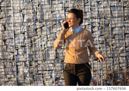 Business Woman Talking on Phone at Train Station 137607606