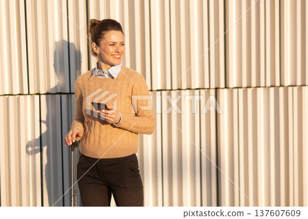 Modern Traveler Waiting at Train Station Platform 137607609
