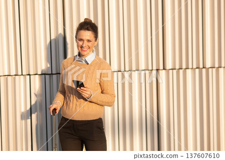 Confident Professional Woman at Modern Railway Station 137607610