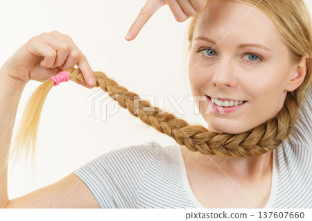 Blonde young woman with braid hair Blonde young woman with braid hair 137607660