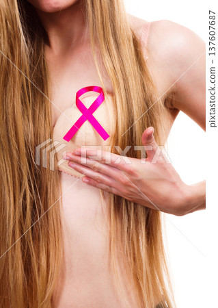 Woman chest in bra, pink cancer ribbon Woman chest in bra, pink cancer ribbon 137607687
