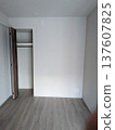 Western-style room interior in a newly built apartment (closet, flooring, white walls) 137607825