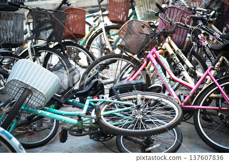 Close-up of bicycles tilted in the parking area 137607836