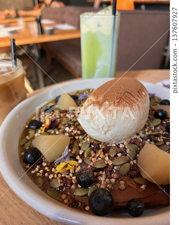 Enjoy ricotta cream pancakes and drinks at a popular Melbourne cafe Enjoy ricotta cream pancakes and drinks at a popular Melbourne cafe 137607927