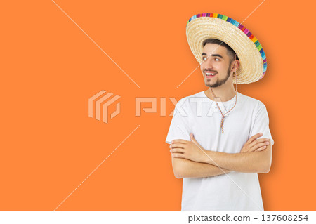 Man with sombrero smiles while celebrating Cinco de Mayo 137608254