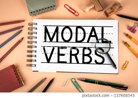 Modal Verbs Text On Notebook Page With Magnifying Glass Education Concept 137608543