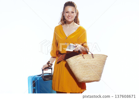 Woman Holding Passport and Straw Bag Ready for Flight 137608671