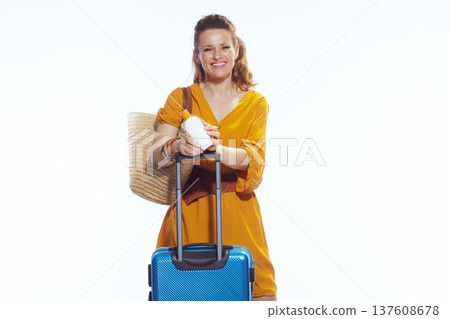 Smiling Traveler with Sunscreen and Suitcase for Summer Vacation 137608678