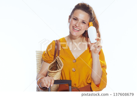 Cheerful Woman with Sunscreen Bottle and Summer Travel Gear Cheerful Woman with Sunscreen Bottle and Summer Travel Gear 137608679