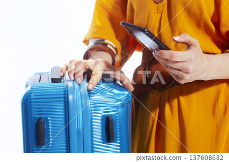 Woman Documenting Dented Luggage on Smartphone Woman Documenting Dented Luggage on Smartphone 137608682