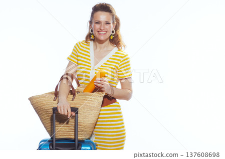 Woman with Blue Suitcase and Sunscreen for Summer Trip Woman with Blue Suitcase and Sunscreen for Summer Trip 137608698
